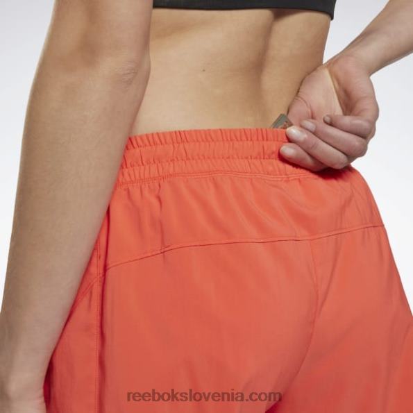 Reebok tekaške hlače R22JR554 pol oranžna flare ženske